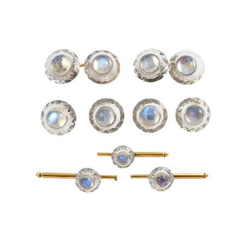 Round moonstone and carved rock crystal gentleman's dress set, probably American, comprising pair of cufflinks, four buttons and three studs,